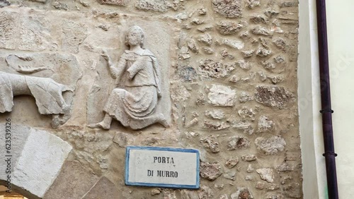 Porta di Murro is the last remaining gate of the walls of the town of Goriano Sicoli. Above the arch is a bas-relief with a lion and two female figure. photo