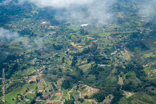 Aerial View of Rionegro Mountains, Hills, Trees, Farms, Houses and Small Facilities in the Countryside near Medellin, Antioquia, Colombia photo