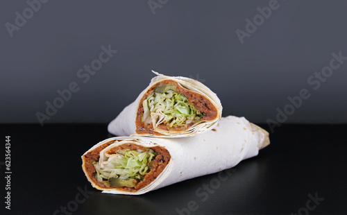 Fotografía Cig kofte durum black background