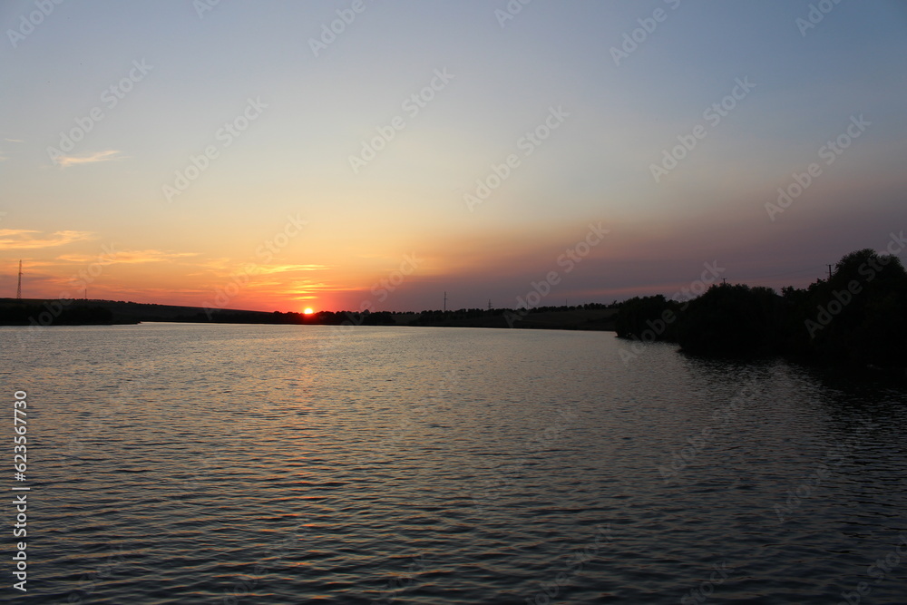 A sunset over a body of water