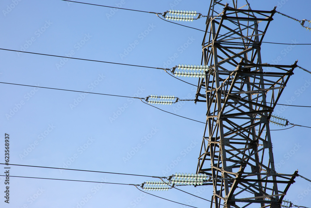 power line support with wires for electricity transmission. High voltage grid tower with wire cable at distribution station. Energy industry. power line support with wires for electricity transmission. High voltage grid tower with wire cable at distribution station. Energy industry.