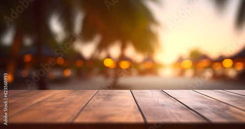 Wooden table and blur beach cafes background with bokeh lights. High quality photo