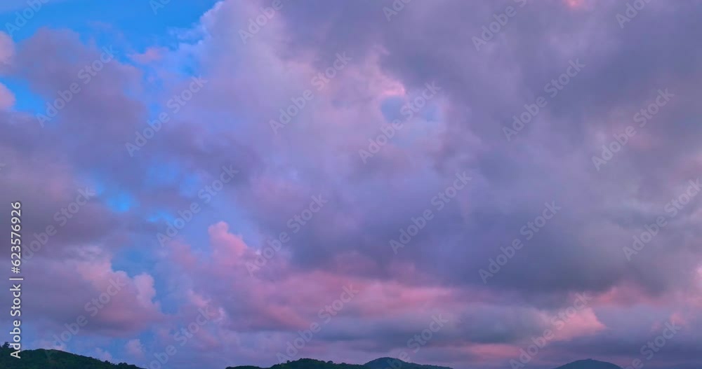 aerial view The purple clouds obscured the bright orange clouds that drifted slowly..Clouds Forming in stunning sunrise..The sky was dark, and in the distance, the clouds began to spin together,