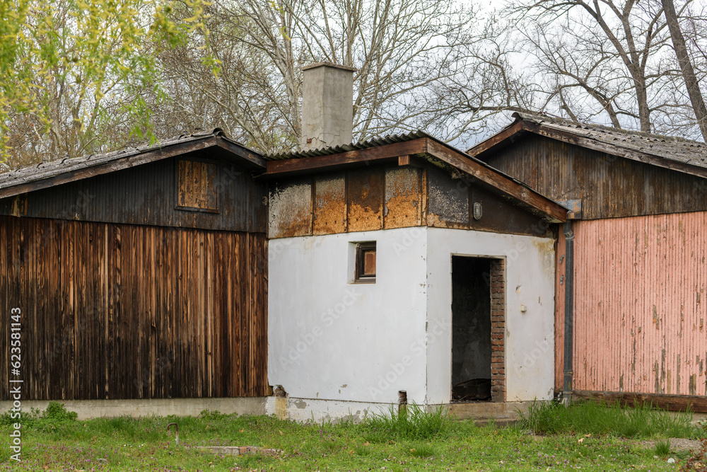 Old abandoned sheds with worn facades Old abandoned sheds with worn facades
