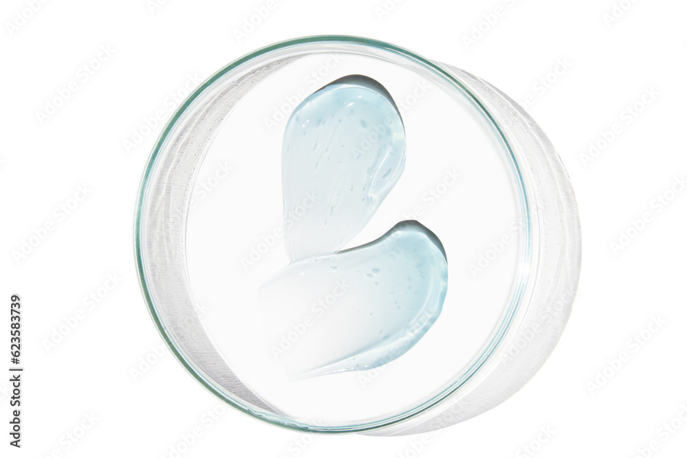 Petri dish with a drop and a smear of a transparent gel or serum on an empty background. Petri dish with a drop and a smear of a transparent gel or serum on an empty background.