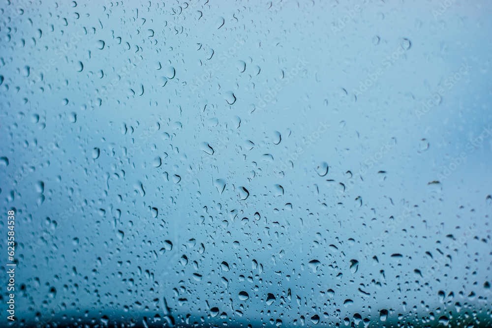 Raindrop on the glass. Waterdrops during raining in cold autumn day Raindrop on the glass. Waterdrops during raining in cold autumn day