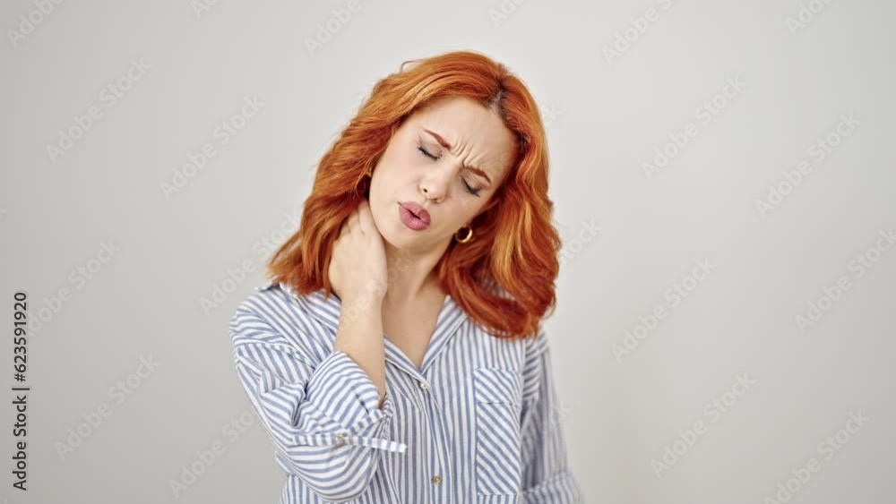 Young redhead woman stressed suffering for cervical pain over isolated white background Young redhead woman stressed suffering for cervical pain over isolated white background