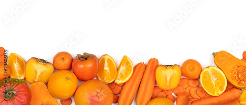 Fototapeta Naklejka Na Ścianę i Meble -  Panoramic set of ripe, juicy orange color fruits and vegetables on white background with copy space. Carrot, orange, persimmon, pumpkin, mandarin,