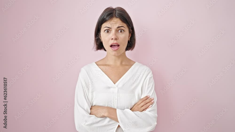 Young beautiful hispanic woman smiling with thumb up over isolated pink background Young beautiful hispanic woman smiling with thumb up over isolated pink background
