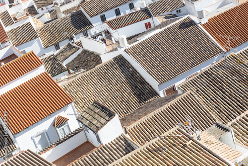 Aerial panoramic view of rooftops of white houses of Olvera town, considered the gate of white towns route in the province of Cadiz, Spain.