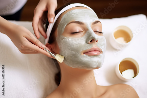Photo of a woman receiving a facial mask treatment at a spa or beauty salon