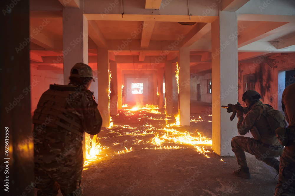 Fototapeta premium A group of professional soldiers bravely executes a dangerous rescue mission, surrounded by fire in a perilous building.