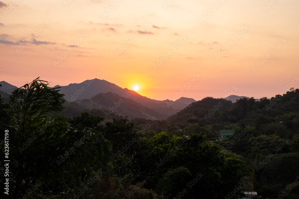 Orange Sunset Over the Pristine Hills of Minca, Colombia Covered with Sub Tropical Woods