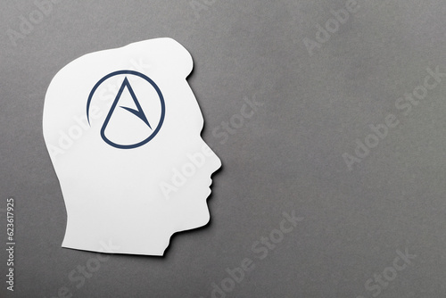 Cuadro en lienzo Paper human head with symbol of atheism on grey background, top view
