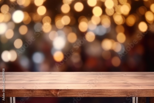 Empty woooden table top with abstract warm living room decor with christmas tree string light blur background 