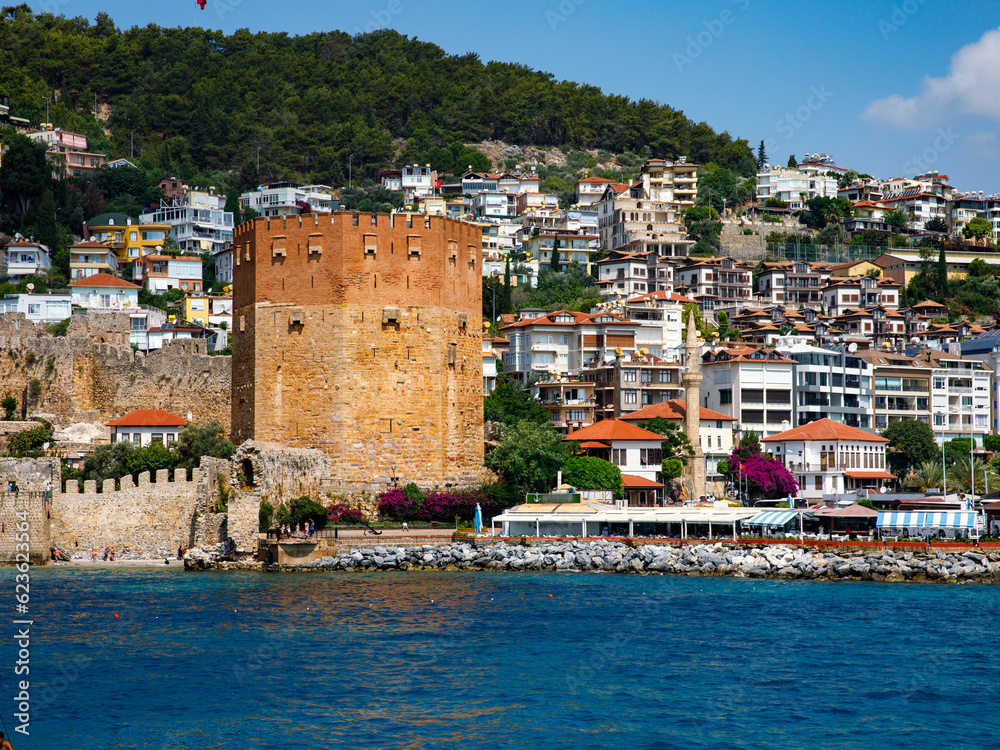 Landscape of ancient shipyard near of Kizil Kule tower in Alanya peninsula, Antalya district, Turkey, Asia. Famous tourist destination with high mountains. Part of ancient old Castle
