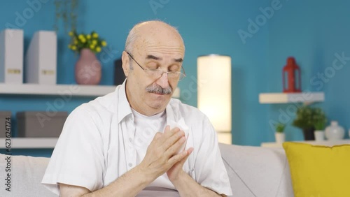 Wallpaper Mural Old man covering mouth and nose while sneezing. Torontodigital.ca
