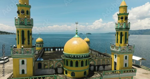 Tropical Landscape with Linuk Masjid mosque in Lanao del Sur. Mindanao, Philippines. photo