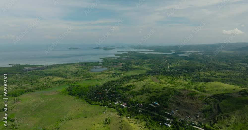 Aerial view scenic of farm and agricultural land with crops in the mountainous area. Mindanao, Philippines. Aerial view scenic of farm and agricultural land with crops in the mountainous area. Mindanao, Philippines.