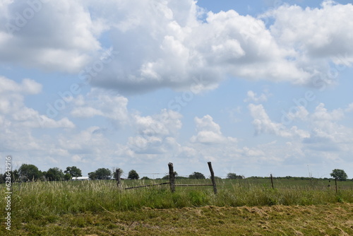 Clouds in a Blue Sky Over a Rural Farm Field