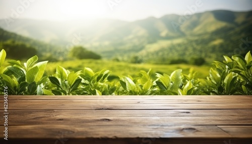 Wooden table in front of tea plantation. Blurred background.