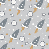Exquisite cosmic seamless surface pattern of whimsical hand drawn space rockets, spacecraft and stars. Doodle astronomy background