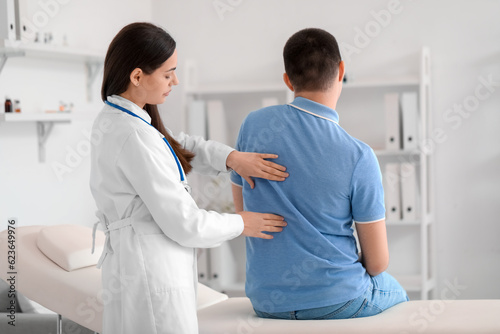 Female doctor checking post...