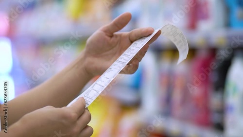 Food prices are rising. Confused customer looking at receip