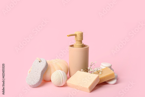 Set of bath supplies on pink background