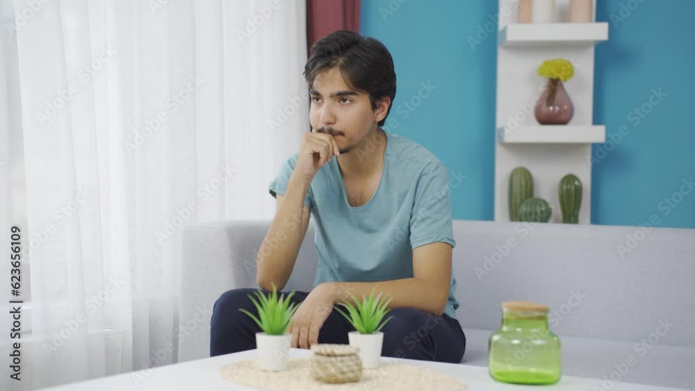 Thoughtful and unhappy man at home.