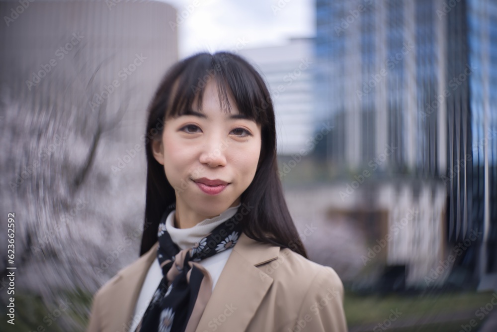 A swirly portrait of Japanese woman behind cherry blossom closeup A swirly portrait of Japanese woman behind cherry blossom closeup
