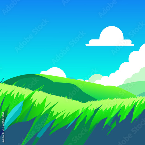 Green short grass with blue sky and clouds