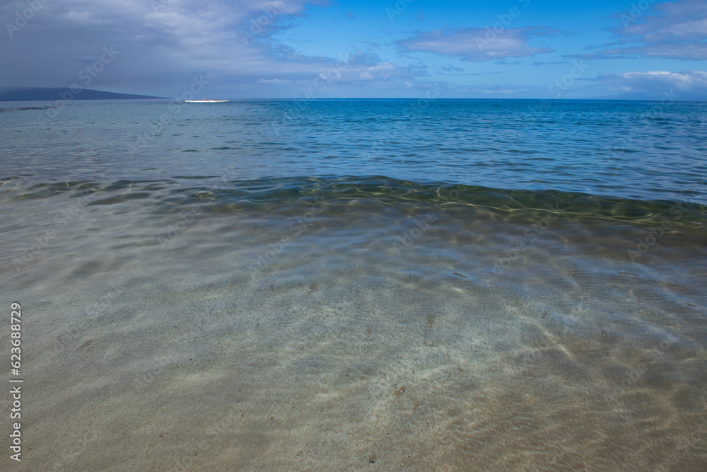 Tropical blue ocean in Hawaii. Summer sea in clean and clear water from surface for background. Waves concept design. Tropical blue ocean in Hawaii. Summer sea in clean and clear water from surface for background. Waves concept design.