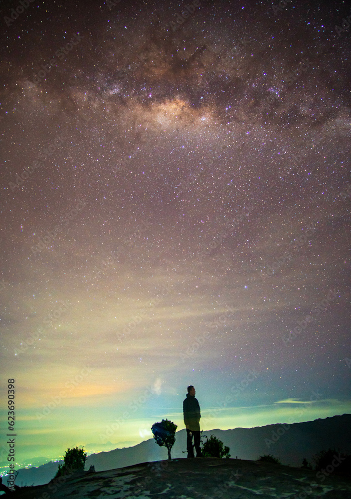 a man and milky way