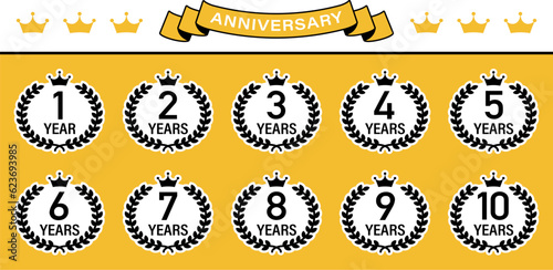 A set illustration of an anniversary emblem with a laurel and crown motif.