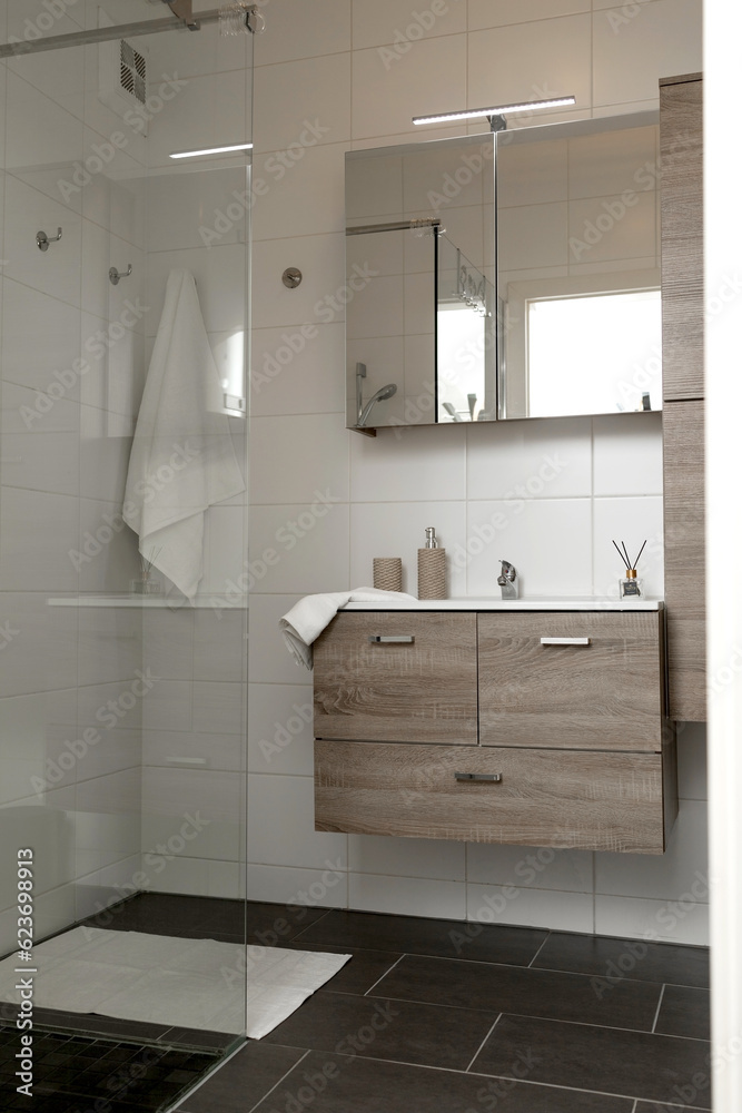Bathroom with shower, locker and mirror Bathroom with shower, locker and mirror
