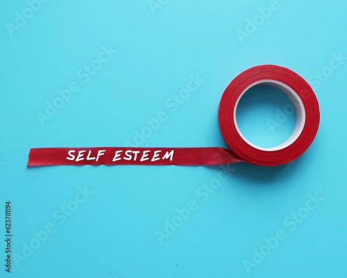 Canvas Print Red tape on blue background with handwritten text SELF ESTEEM,  subjective sense