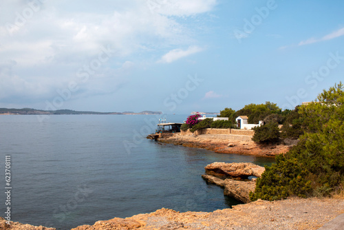 View of beach and restaurant at cala nieves, santa eularia des riu, ibiza, balearic islands, spain, mediterranean, europe photo