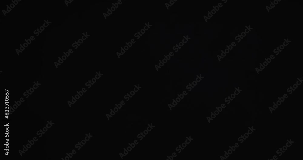 Video of blue sand grains thrown in air and copy space on black background Video of blue sand grains thrown in air and copy space on black background