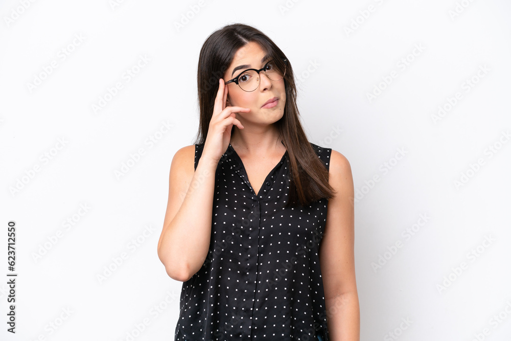 Young Brazilian woman isolated on white background thinking an idea Young Brazilian woman isolated on white background thinking an idea