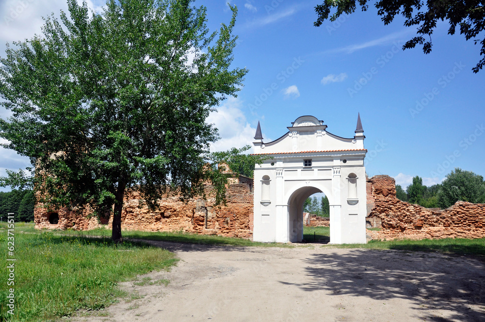 Restored entrance gate and remains of the walls of the Carthusian monastery of 1648-1666 in the town of Bereza, Belarus.
