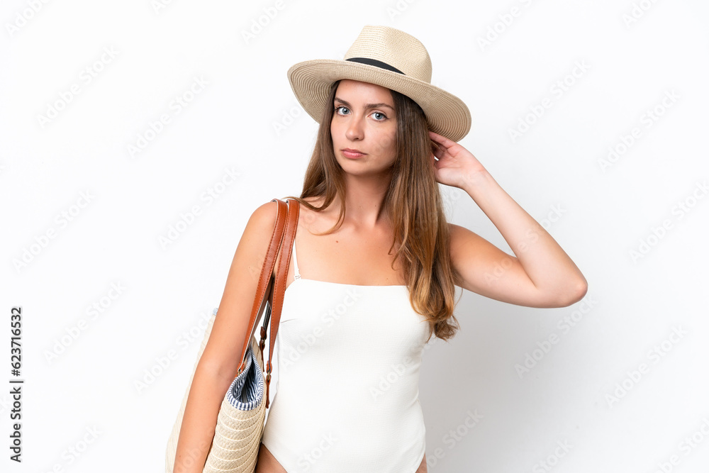 Young caucasian woman in swimsuit in summer holidays isolated on white background having doubts Young caucasian woman in swimsuit in summer holidays isolated on white background having doubts