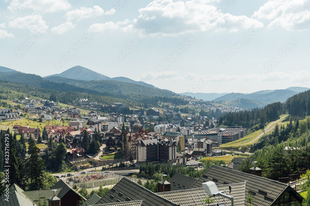 A review view of the resort city in the Carpathian mountains. Roofs of houses and mountains look very atmospheric