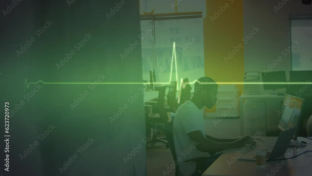 Animation of glowing light over african american businessman in office