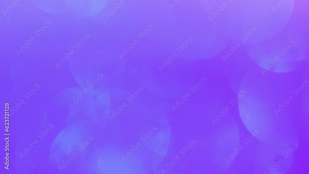Blue Bokeh Motion On Purple Background. Abstract movement of pale blurry circles with light spots. Amazing dreamslike backdrop.