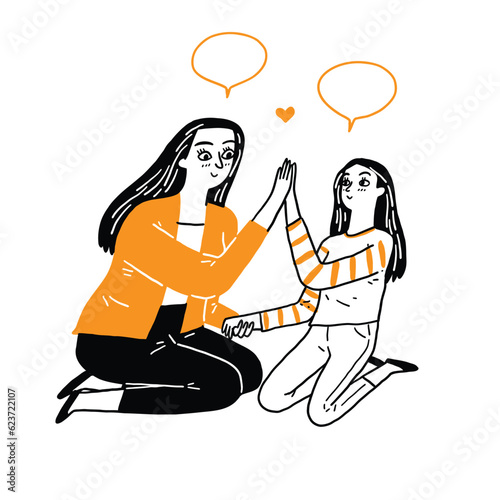 Asian black hair little playful daughter smiling touch hands hi five with beautiful young mother.