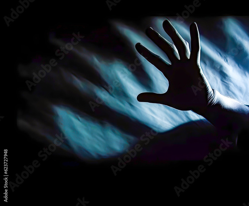 the shadow of a person reaching up to a hand  darkness  dark background