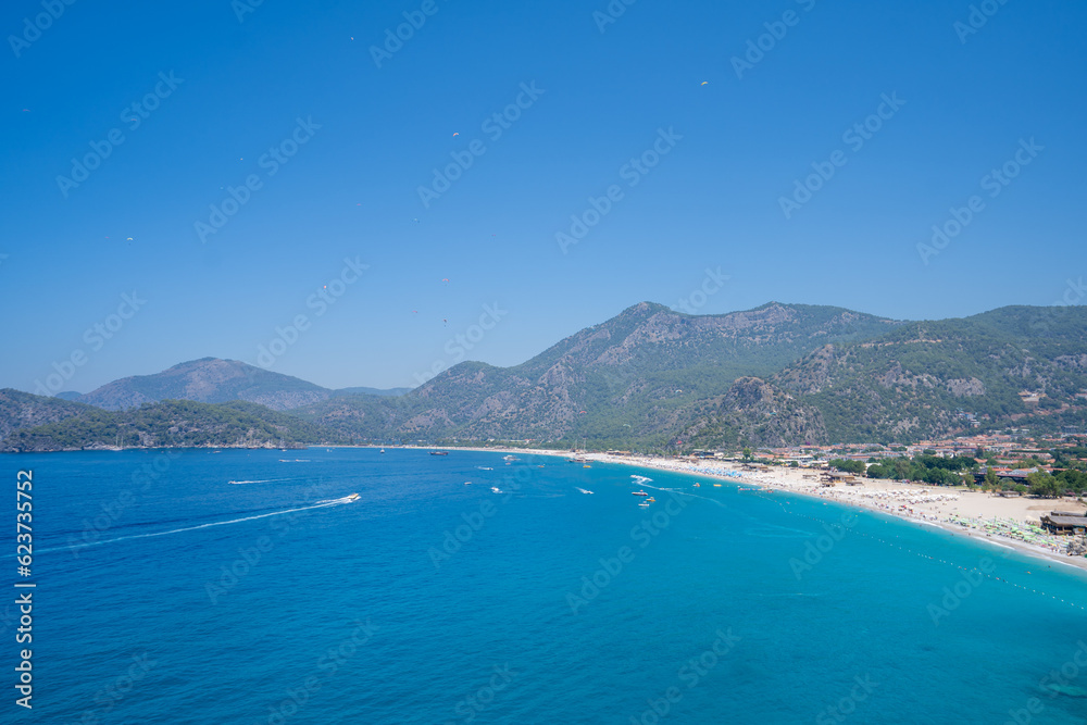 View of Belcekiz (Belcegiz) Beach and Oludeniz (Blue Lagoon). Mugla, Turkey - July 10, 2023.
