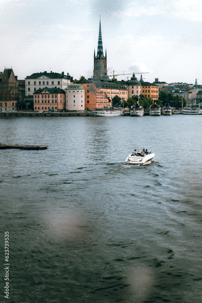 Driving a boat towars the old town of Stockholm