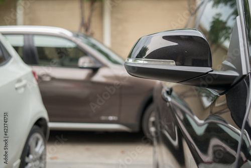 Fototapeta Naklejka Na Ścianę i Meble -  Closeup luxury car side mirror